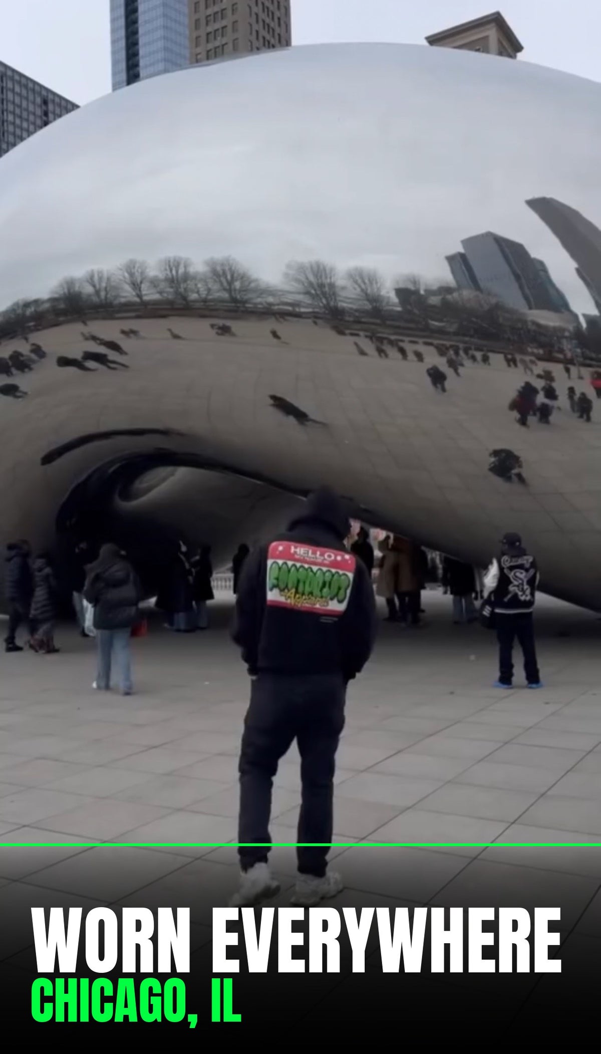 Person in a Footprint Apparel HELLO FOOTPRINT hoodie in front of Cloud Gate (the Chicago Bean) in Chicago