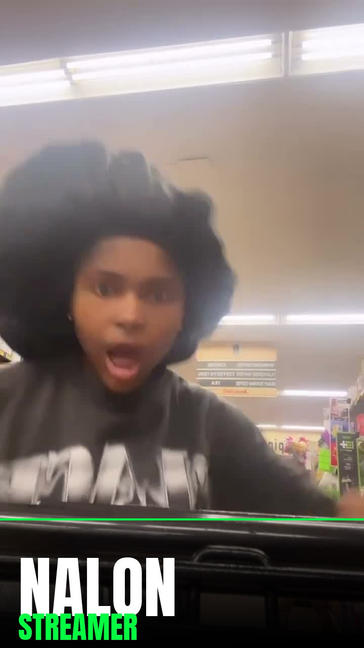 Streamer Nalon pushing a cart while wearing Footprint Apparel