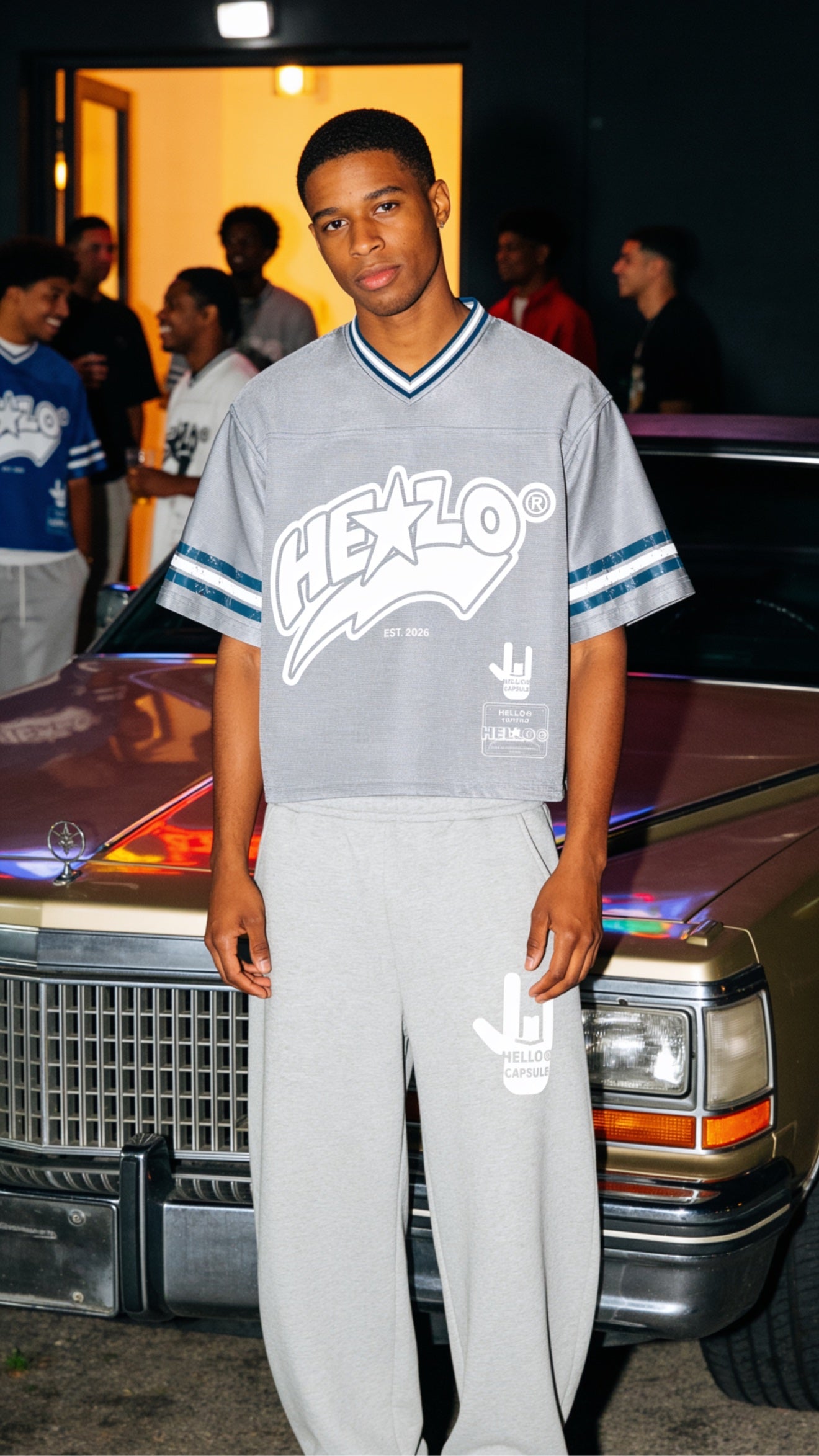 Grey HELLO jersey set by a vintage Cadillac at night